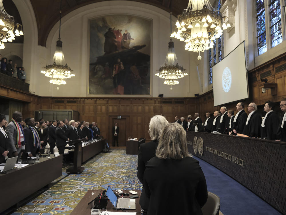 Judges and parties stand up during a hearing at the International Court of Justice in The Hague, Netherlands, Friday. The United Nations' court opened hearings Thursday into South Africa's allegation that Israel's war with Hamas amounts to genocide against Palestinians, a claim that Israel strongly denies.