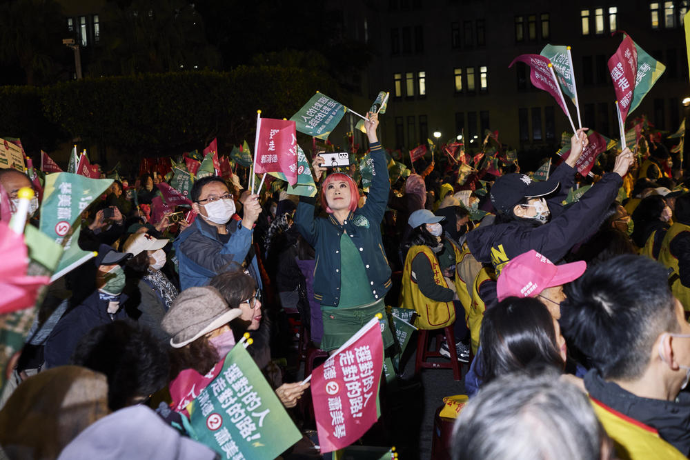 DPP supporters cheer at a rally in January.