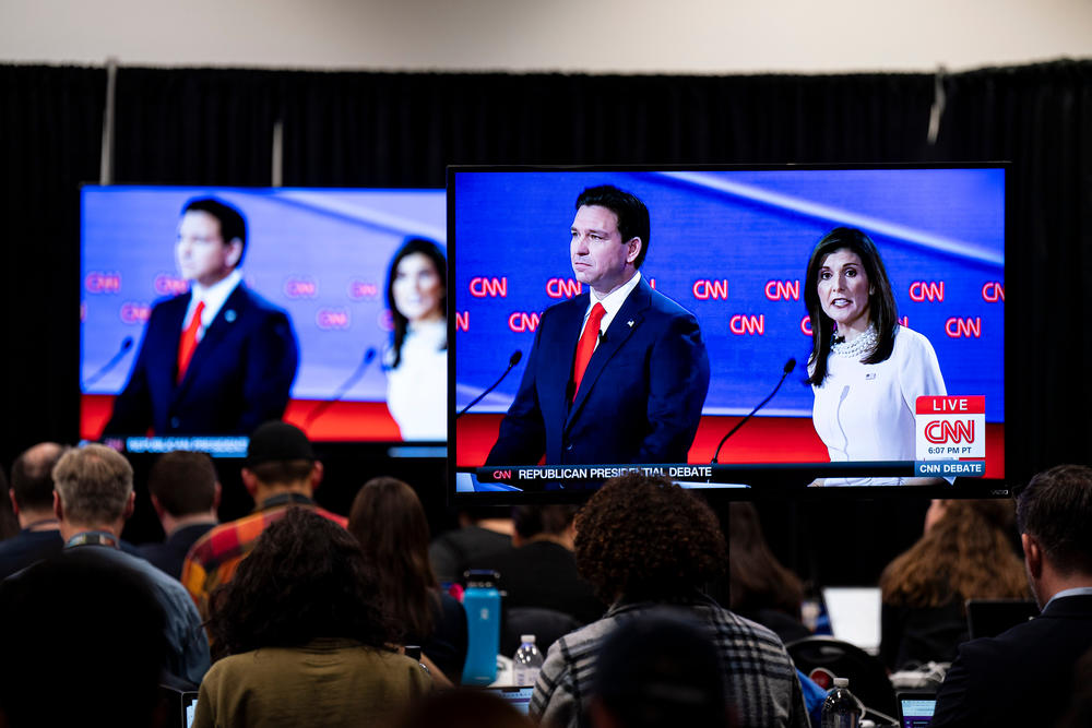 A television in the media filing room displays Ron DeSantis, governor of Florida and 2024 Republican presidential candidate, and Nikki Haley, former ambassador to the United Nations and Republican presidential candidate, during a CNN debate in Des Moines, Iowa, on Jan. 10.