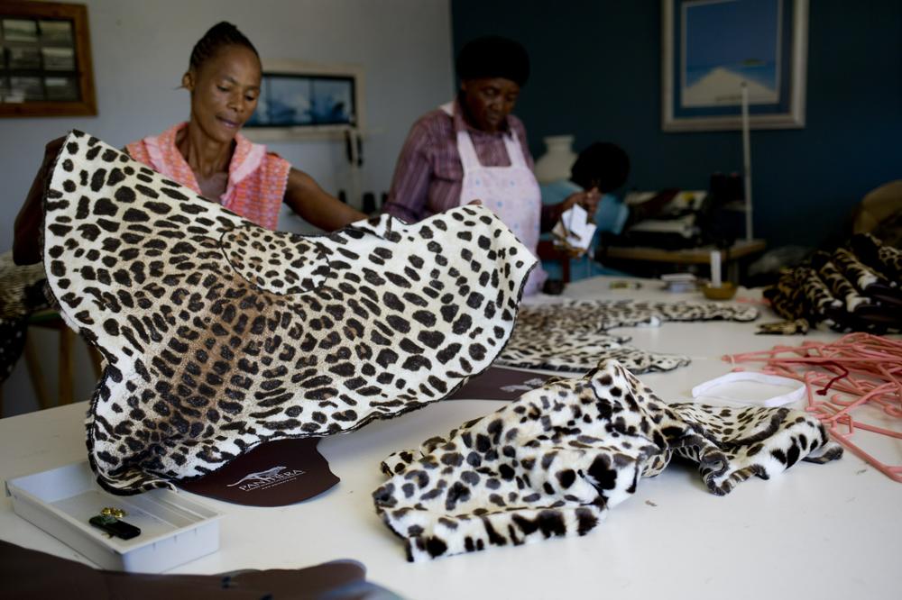 Workers make fake leopard skin clothes in Durban, South Africa, in 2014. Leopard skins symbolize pride and royalty in the Shembe Church, a traditionalist Zulu church. But as lost habitat and poaching have sent the cats' numbers plummeting, church leaders have agreed with conservationists to offer a cheaper, synthetic alternative.