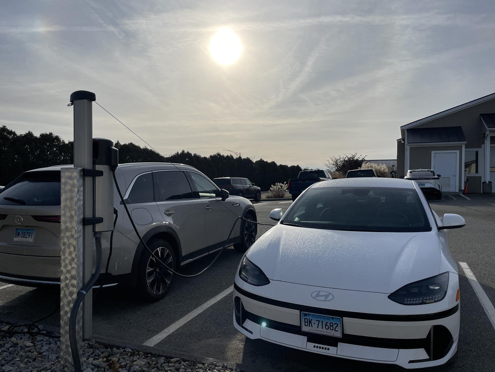 An electric vehicle charges outside the Consumer Reports auto testing facility. The organization has started adding electric vehicle-specific tests to its evaluations.
