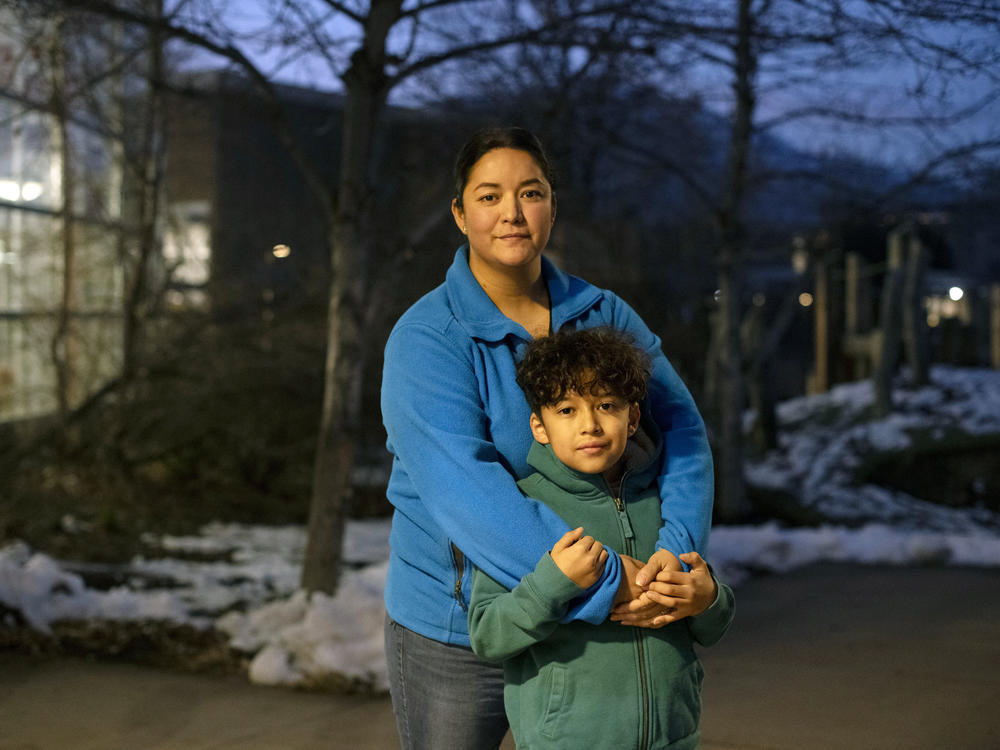 Maribel Martinez and her son, Ivan Monreal-Martinez, 9, at the Boulder Public Library on the night of the December coupon distribution for the Fruit & Veg program.