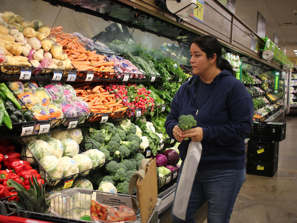 Maribel Martinez shops the produce section at King Sooper's in Boulder, Colo., the day after picking up her Fruit & Veg coupons.