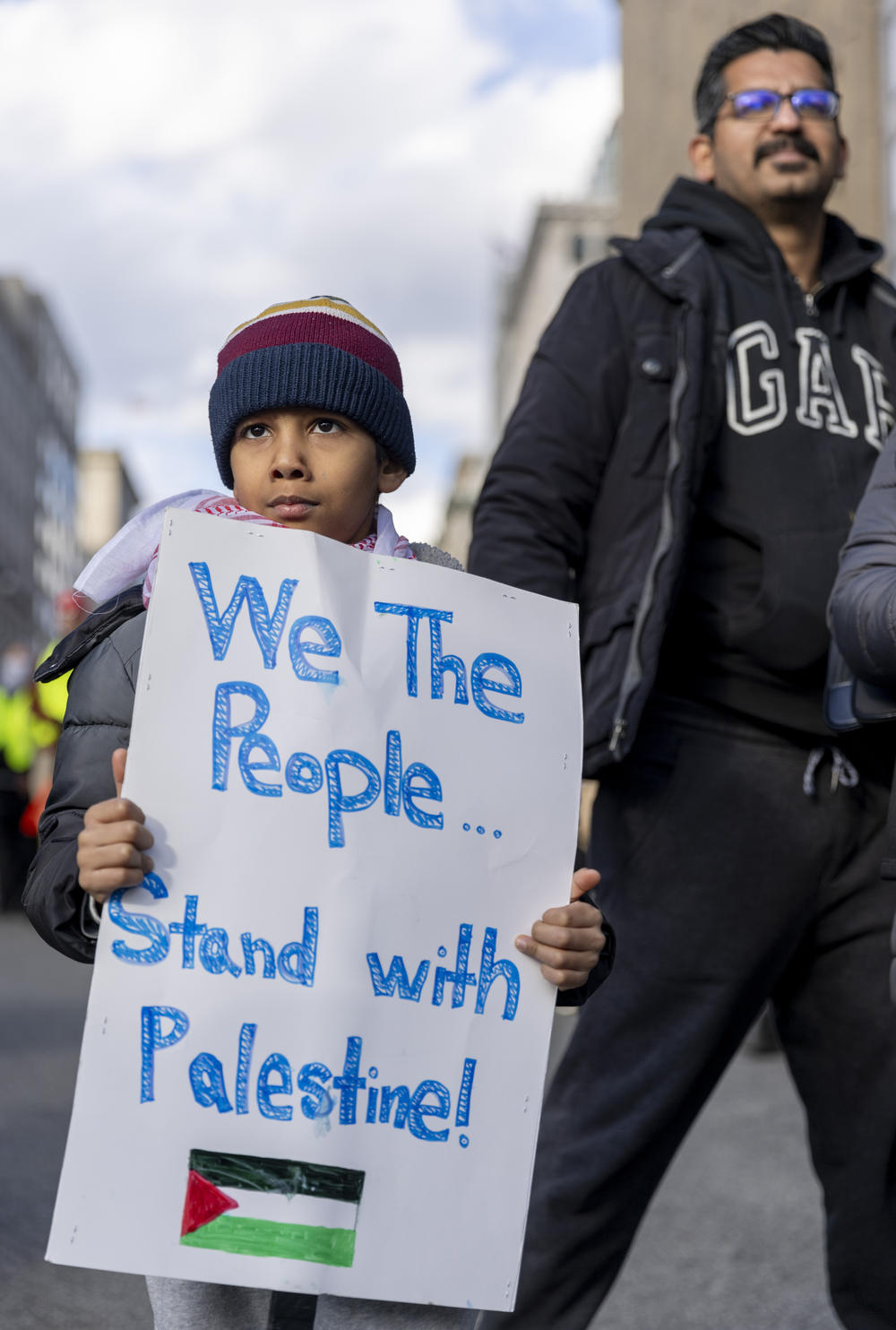 A child attending the rally held his sign.