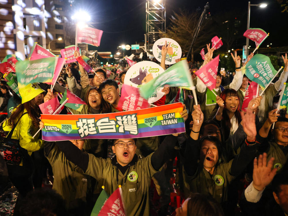 Supporters of Lai Ching-te react after Lai won the presidential election outside the party's headquarters in Taipei on Saturday.