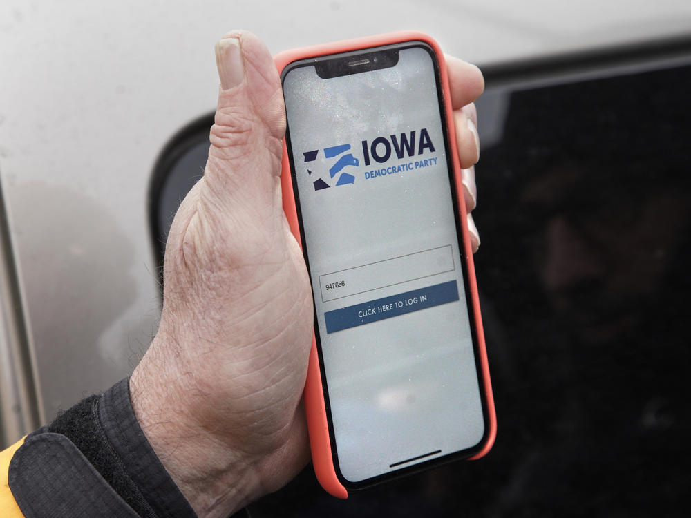A precinct captain displays the Iowa Democratic Party caucus reporting app on his phone on Feb. 4, 2020. The app's technical difficulties marred Democrats' 2020 Iowa caucuses.