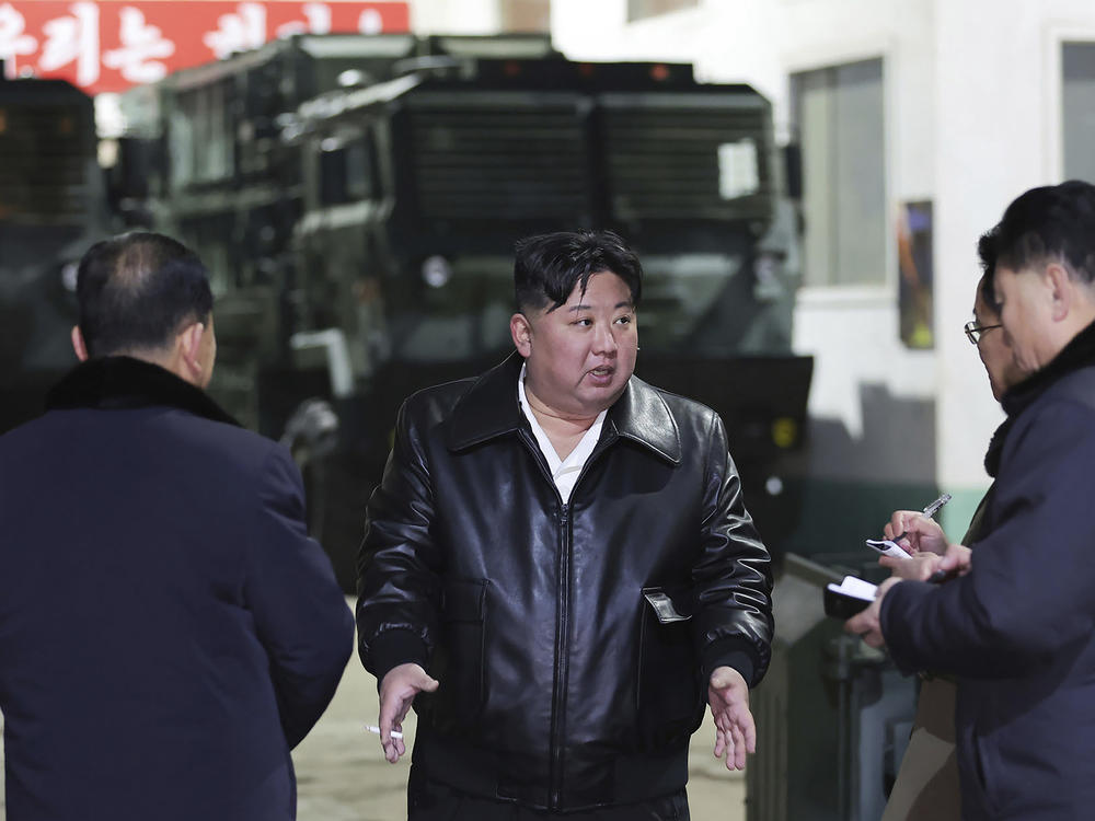 In this photo provided by the North Korean government, North Korean leader Kim Jong Un, center, inspects as he tours munitions factories in North Korea on Jan. 8-9, 2024.