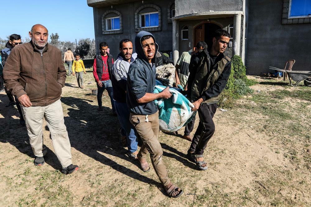 Men carry the body of a Palestinian killed in an Israeli airstrike in Rafah earlier this month.