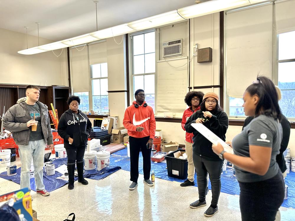 Members of AmeriCorps, a federal volunteerism agency, gather at Herzl Elementary School on Chicago's West Side for a beautification project. It was postponed because of inclement weather.