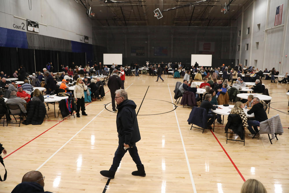 Voters gather at a caucus site to cast their votes in Wes Des Moines on Jan. 15, 2024