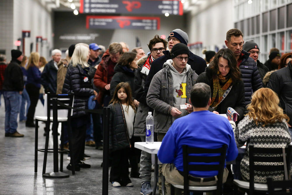 Voters waiting in line at a caucus site in West Des Moines, Iowa on Jan. 15, 2024.