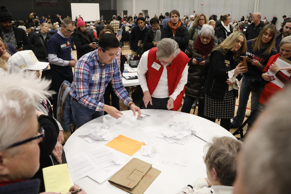 Ballots being collected and counted at a West Des Moines caucus site on Jan. 15, 2024.
