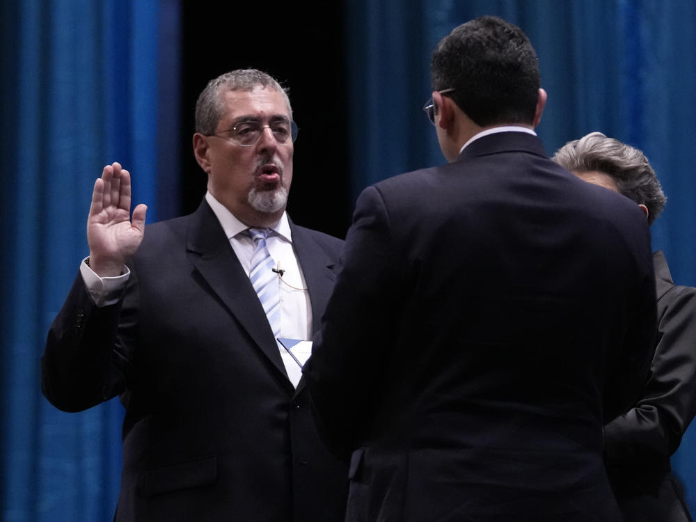 Incoming Guatemalan President Bernardo Arévalo takes the oath of office during his swearing-in ceremony in Guatemala City, early Monday, Jan. 15, 2024.