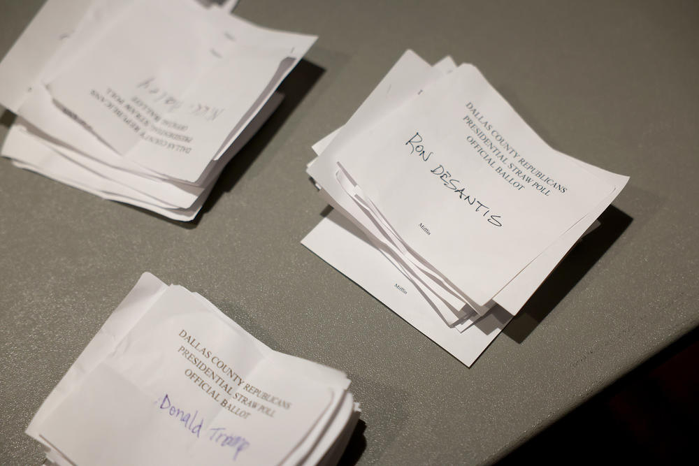 Ballots are stacked on a desk after being counted by Republican caucus officials on January 15, 2024, in West Des Moines, Iowa.