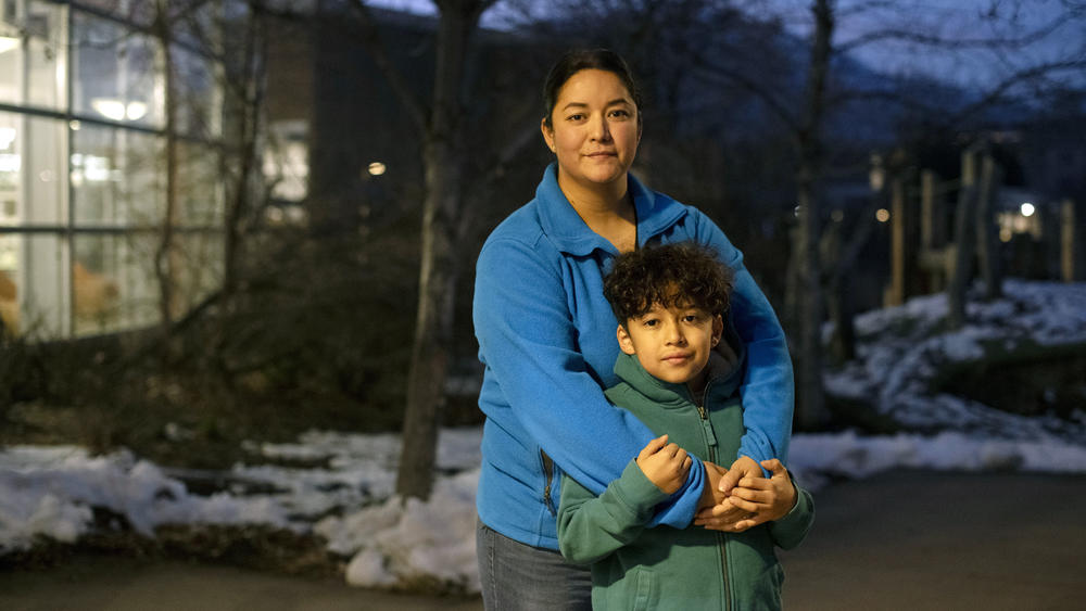 Maribel Martinez and her son, Ivan Monreal-Martinez, 9, at the Boulder Public Library on the night of the December coupon distribution for the Fruit & Veg program.