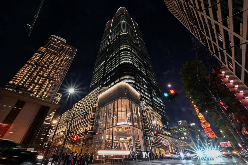 A view of Tokyo's new skyscraper, the Azabudai Hills Mori JP Tower complex, after its official opening earlier in the day on Nov. 24. The tower has residential units and office space.