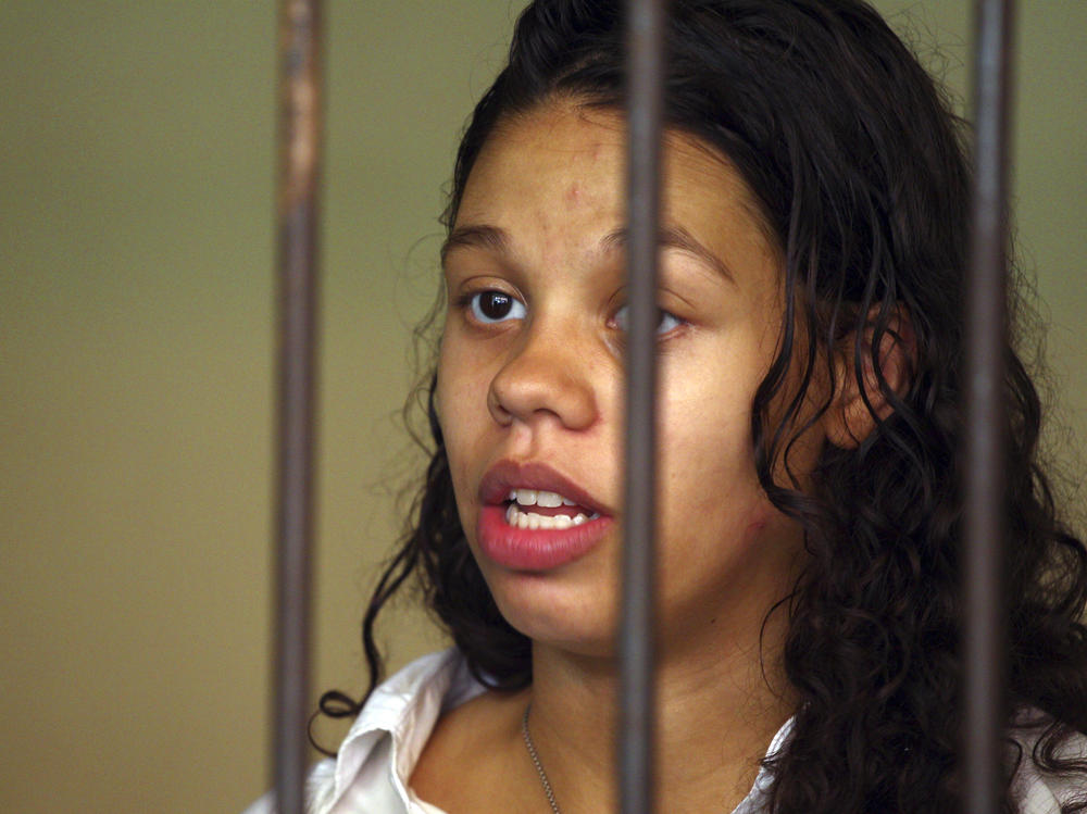 Heather Mack from Chicago, Ill., stands inside a cell before a trial in Bali, Indonesia, on March 11, 2015. Mack, who pleaded guilty to helping kill her own mother and stuffing the body in a suitcase during a luxury vacation in Bali, was sentenced by a federal judge, Wednesday to 26 years in prison.