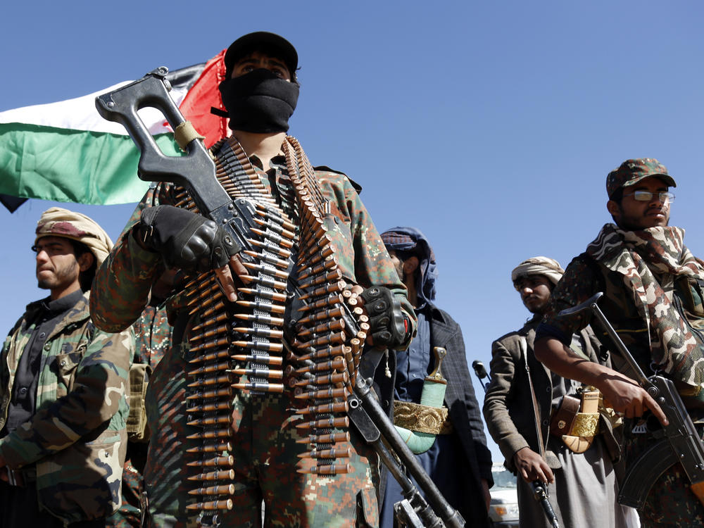 Houthi fighters and tribesmen stage a rally against the U.S. and the U.K. strikes on Houthi-run military sites near Sanaa, Yemen, on Sunday, Jan. 14.