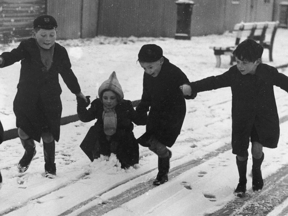 Children play in the snow in Yarmouth, on the Isle of Wight, off England's southern coast, in 1940.