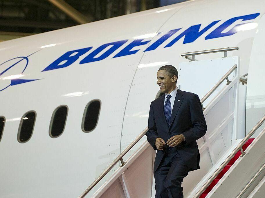Then-President Barack Obama walks down the stairs of a Boeing 787 Dreamliner at the company's production facility in Everett, Wash., in 2012.