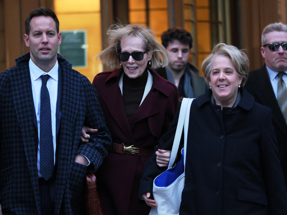 E. Jean Carroll (center) and her attorney Roberta Kaplan leave Manhattan Federal Court on Thursday in New York City.