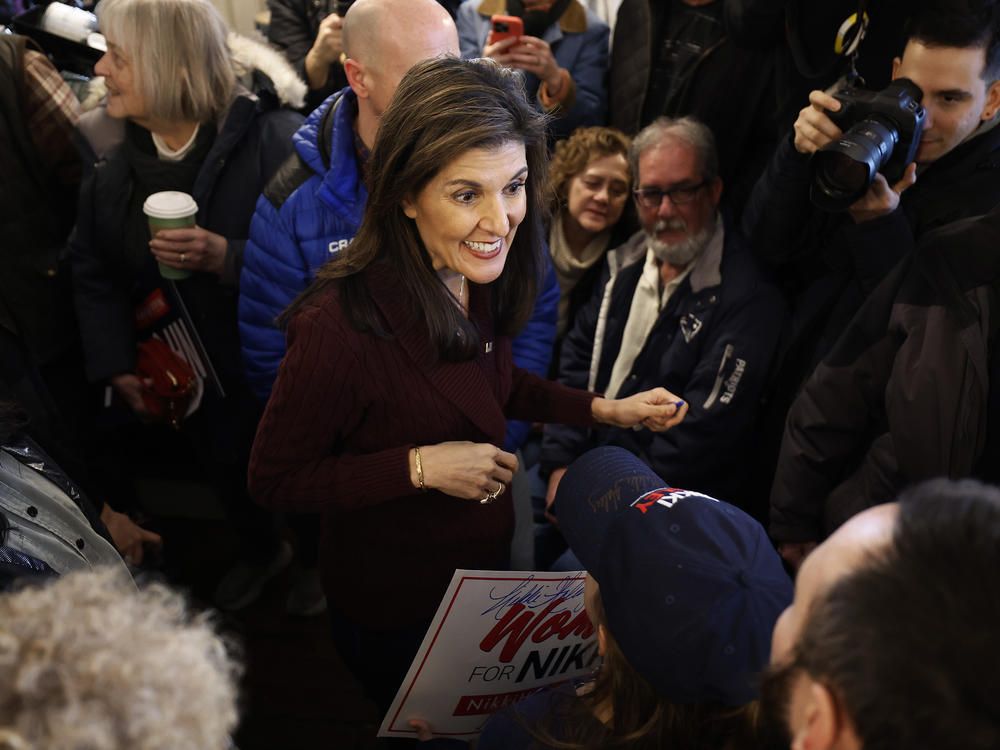 Republican presidential candidate and former UN Ambassador Nikki Haley talks with people at the historic Robie Country Store on January 18, 2024 in Hooksett, New Hampshire.