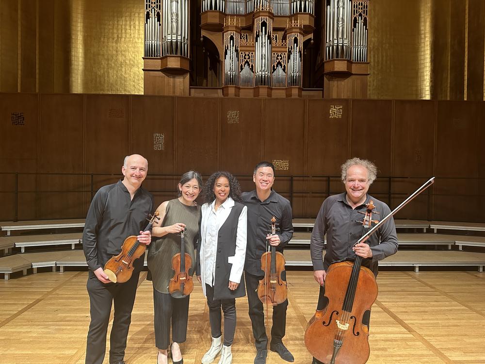 The Takács Quartet — left to right: Edward Dusinberre, Harumi Rhodes, Richard O'Neill and András Fejér — collaborated with composer Nokuthula Ngwenyama (center) to premiere her composition 