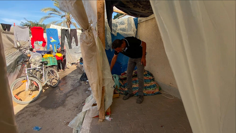 The modest interior of the shelter where displaced Palestinian Yaser al-Amor is staying with his family.