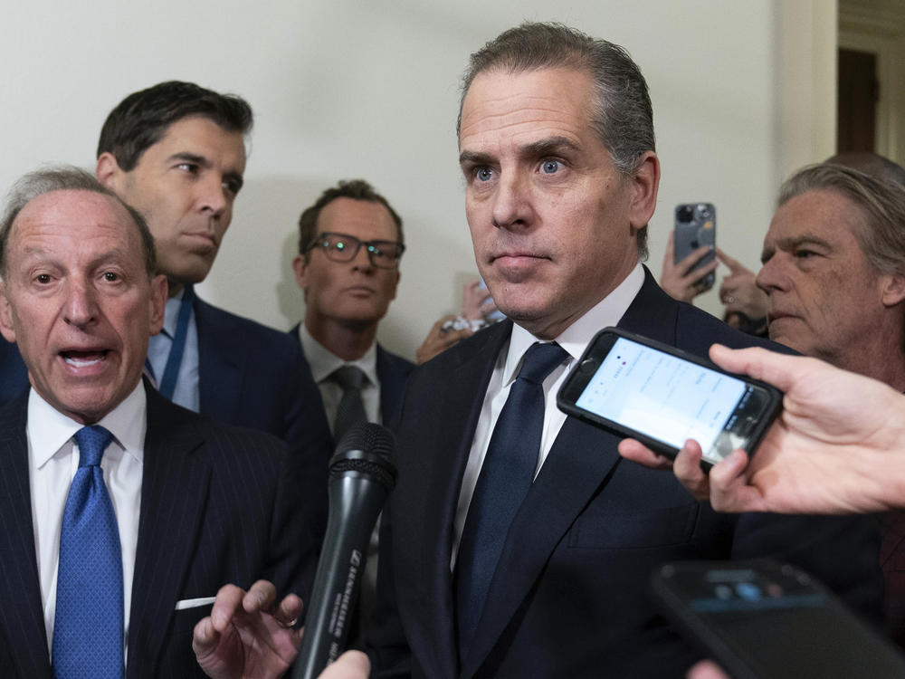 Hunter Biden, President Joe Biden's son, accompanied by his attorney Abbe Lowell, left, talks to reporters as they leave a House Oversight Committee hearing as Republicans are taking the first step toward holding him in contempt of Congress, Wednesday, Jan. 10, 2024, on Capitol Hill in Washington.