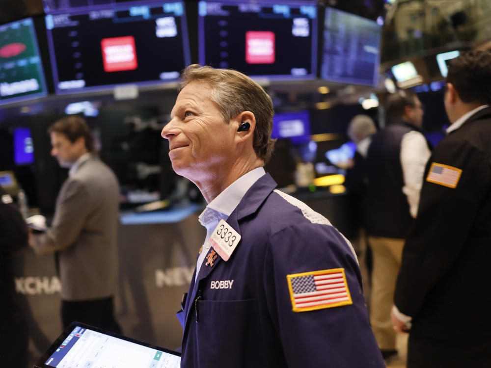The S&P 500 hit a record high on Friday, boosted by gains in technology share and by rising hopes about the economy.