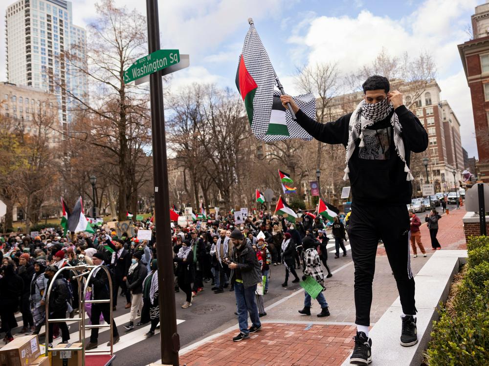 Protesters supporting Palestinians are regular features at President Biden's trips around the country, including a visit to Philadelphia on Dec. 11, 2023.