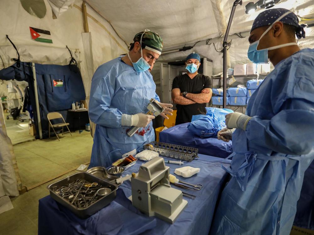 Dr. Ghassan Al-Suwaiti, a Jordanian plastic surgeon and burn specialist, performs an operation in December at Jordan's field hospital in Khan Younis.