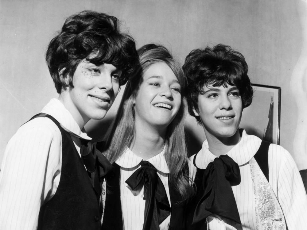Three members of the Shangri-Las are seen on a visit to London in 1964, with Mary Weiss pictured in between twins Marge and Mary Anne Ganser.
