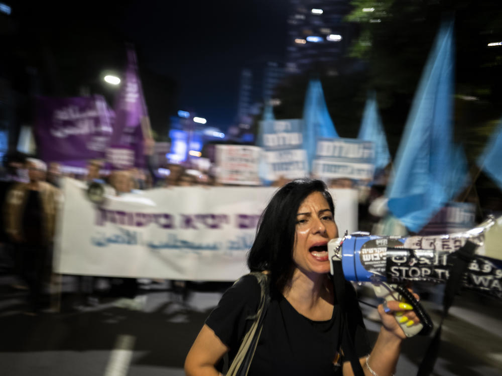 Protesters at a rare anti-war rally in Tel Aviv Thursday. The crowd was made up of people of all ages, many belonging to groups that have long called for an end to Israel's occupation of Palestinian territories.