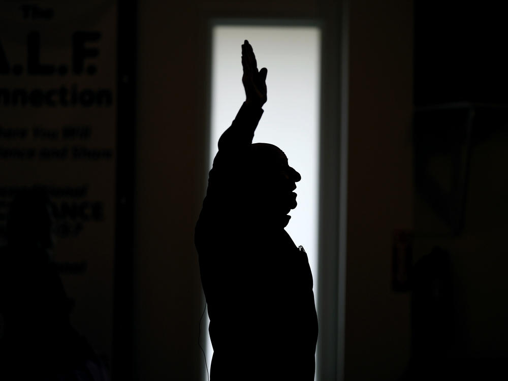 First Church of God Pastor Charles Hundley sings a hymn during the morning service, Sunday, Jan. 7, in Des Moines, Iowa. Former President Donald Trump and his rivals for the GOP nomination have pushed for endorsements from pastors and faith communities. Evangelicals and religious Christian groups are traditionally critical to the Republican Party.