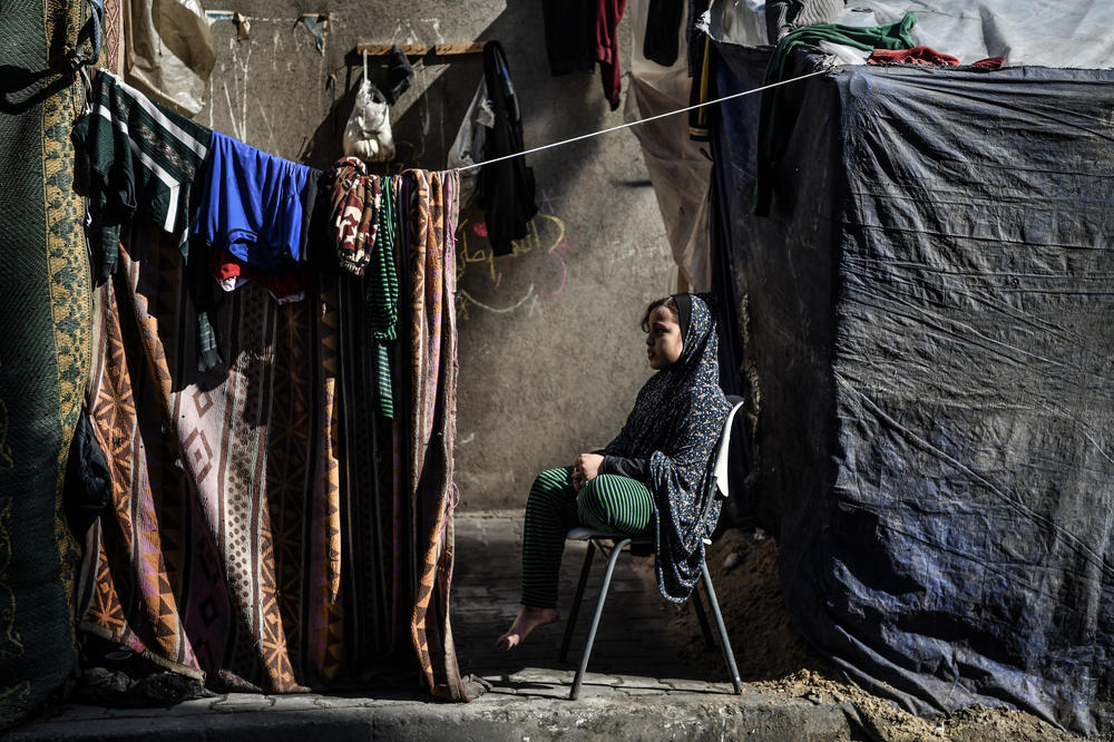 Palestinian families who had to leave their homes live with a lack of food and supplies in the tent city in Rafah, where they took shelter to protect themselves from Israeli attacks, on Jan. 20.