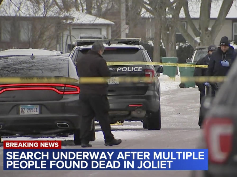 In this frame grab from video provided by WLS-TV ABC 7 Chicago, authorities work a scene in Joliet, Ill., on Monday, Jan. 22, 2024, after discovering eight people shot and killed at three locations since Sunday in the Chicago suburbs.
