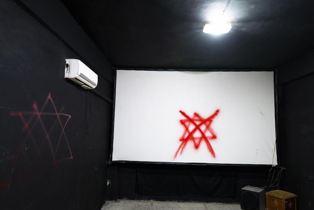 Spraypainted graffiti inside the theater, which residents say was done by Israeli soldiers.