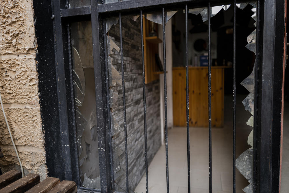 Shattered glass marks the entrance of the Freedom Theatre's offices in the Jenin refugee camp. Residents say Israeli soldiers vandalized the premises.