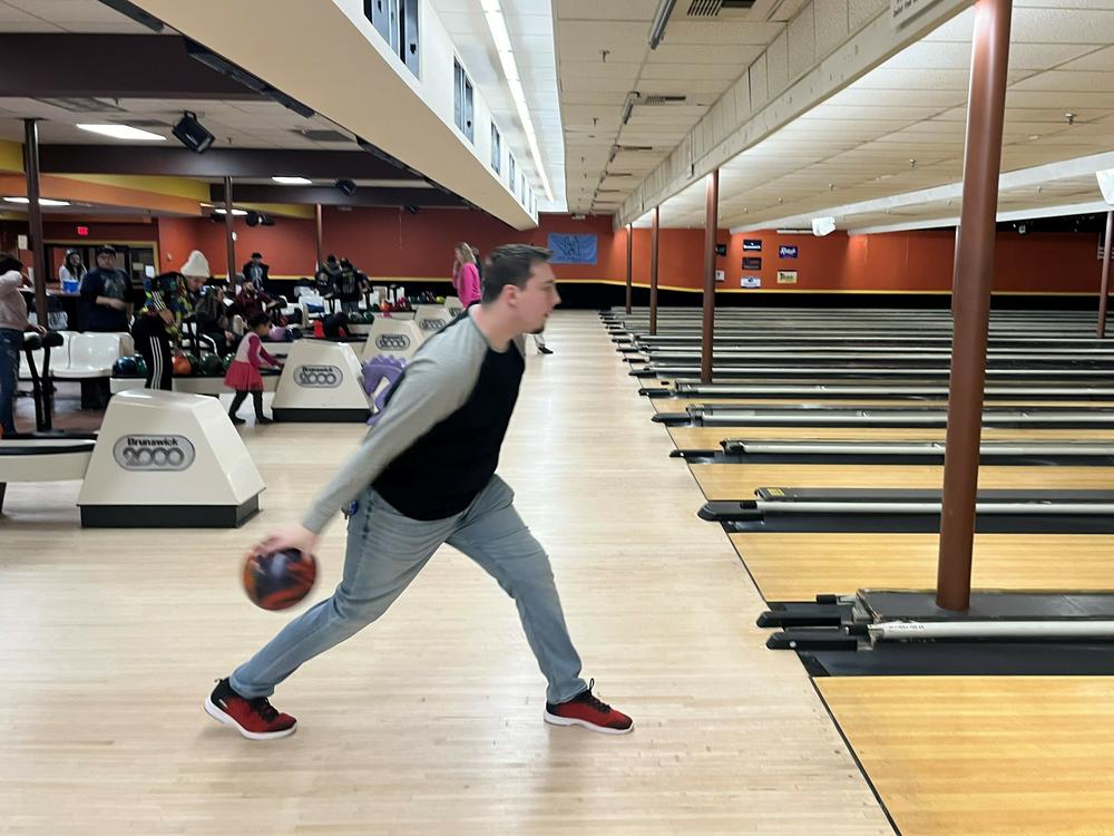 Luke Rose, 26, spends evening bowling with some friends in Manchester, NH on Jan. 21, 2024.