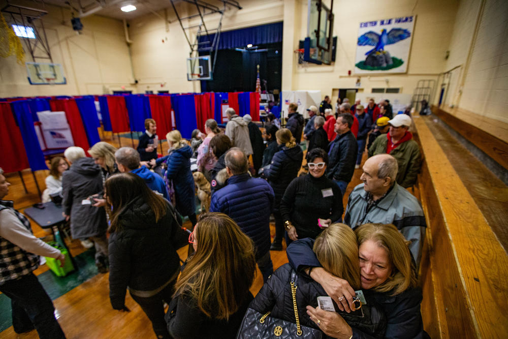 Voters line up to register to vote at the Talbot Gym in Exeter, N.H. on Jan. 23, 2024.