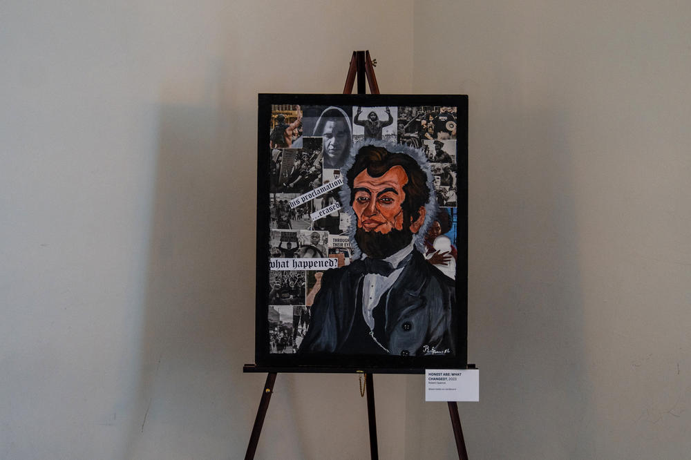 A mixed media work featuring a portrait of President Abraham Lincoln is on display at the exhibition.