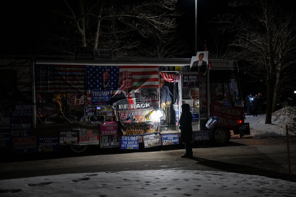 A person stops to see a pro-Donald J. Trump RV outside the Sheraton Nashua on Tuesday, Jan. 23, 2023, in Nashua, N.H. following Trump's win in the New Hampshire primary.
