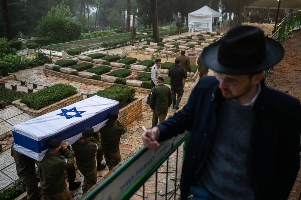 Israeli soldiers carry the casket of reservist Elkana Yehuda Sfez, who was killed in combat in Gaza, during his funeral at the Mount Herzl military cemetery in Jerusalem on Tuesday.