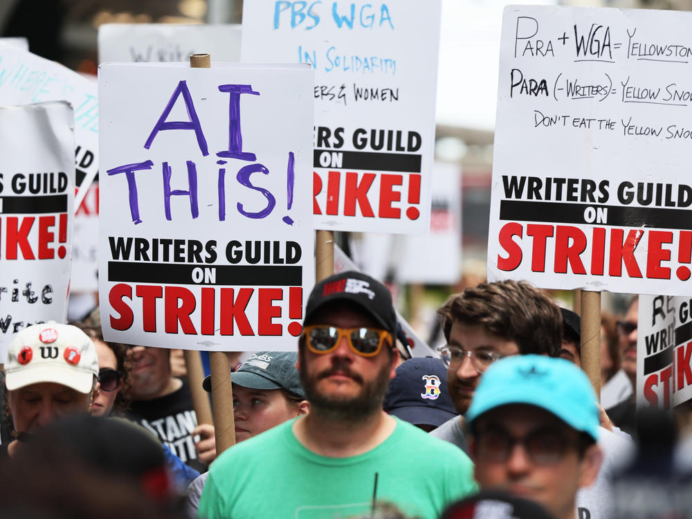 Members of the Writers Guild of America East picket at the Warner Bros. Discovery NYC office on July 13, 2023 in New York City.