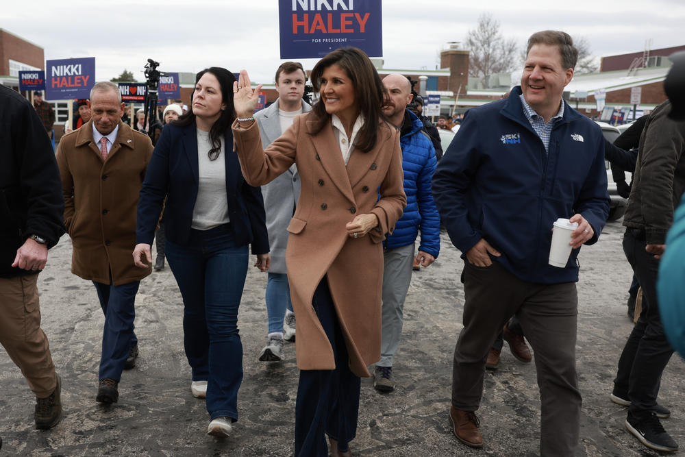 Republican presidential candidate, former U.N. Ambassador Nikki Haley is joined by New Hampshire Gov. Chris Sununu as they visit a polling location at Winnacunnet High School to greet voters on Jan. 23, 2024, in Hampton, N.H.