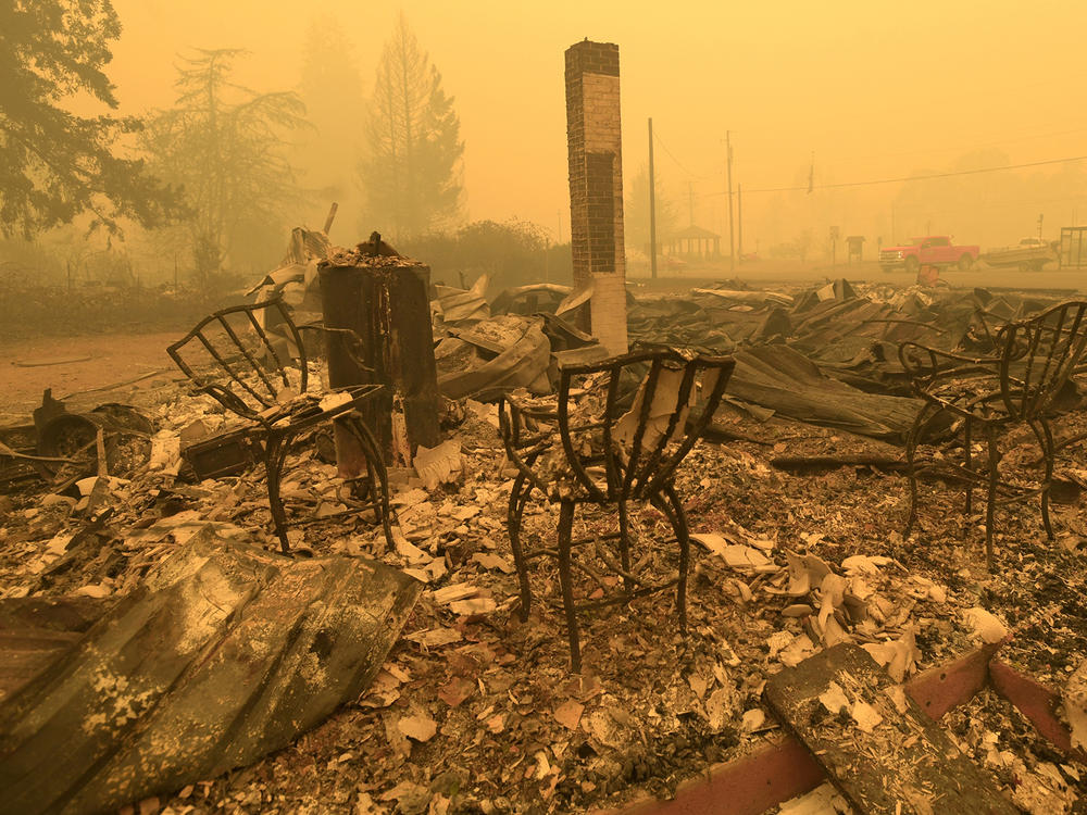 Chairs stand at the local post office in the aftermath of a fire in Gates, Ore., on Sept 9, 2020. An Oregon jury on Tuesday awarded $85 million to nine victims of wildfires that ravaged the state in 2020, in the latest trial faced by utility PacifiCorp over its liability in the deadly blazes.