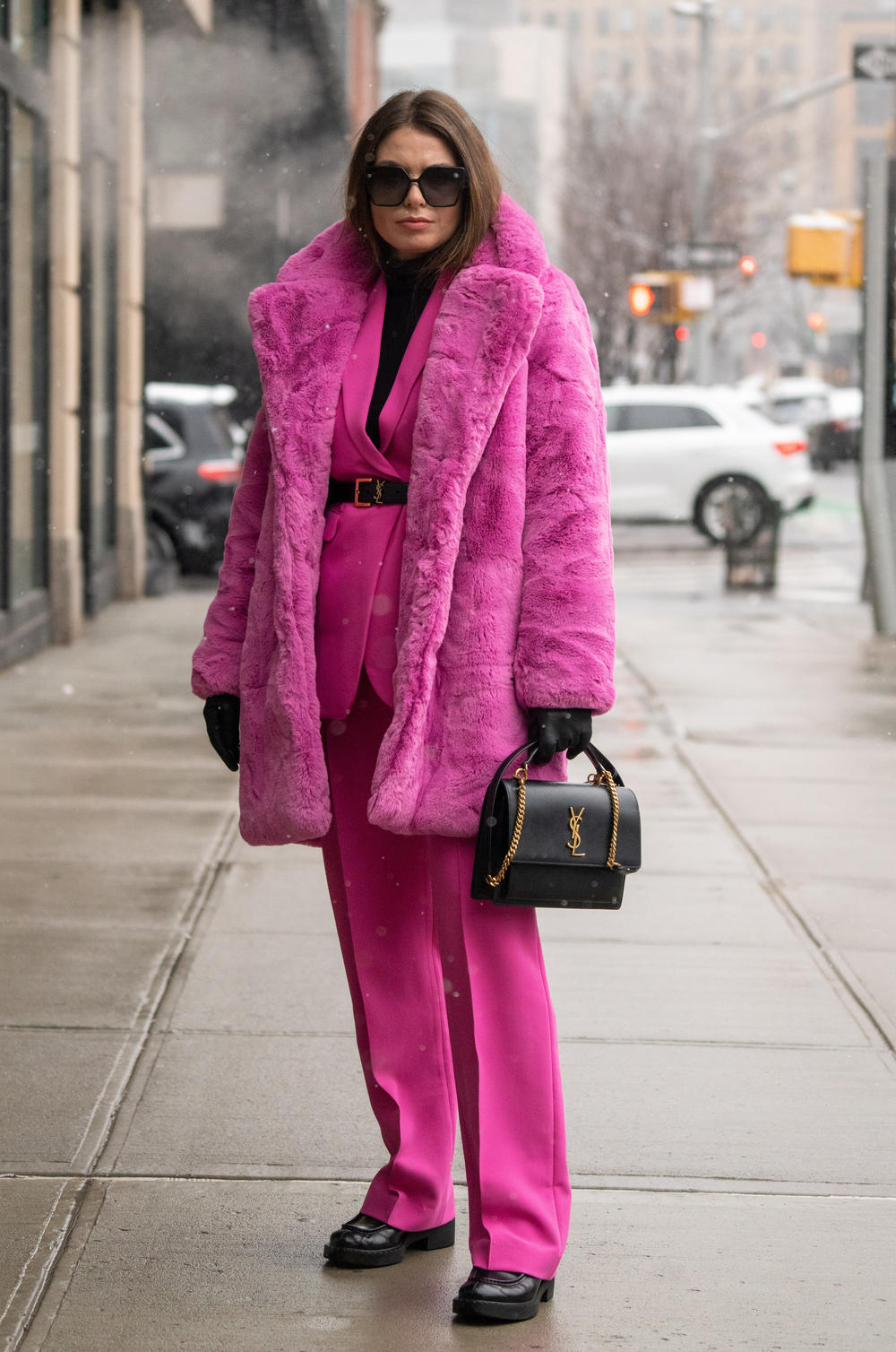 Natalia Levsina wears a faux fur coat by Apparis to New York Fashion Week in 2022.
