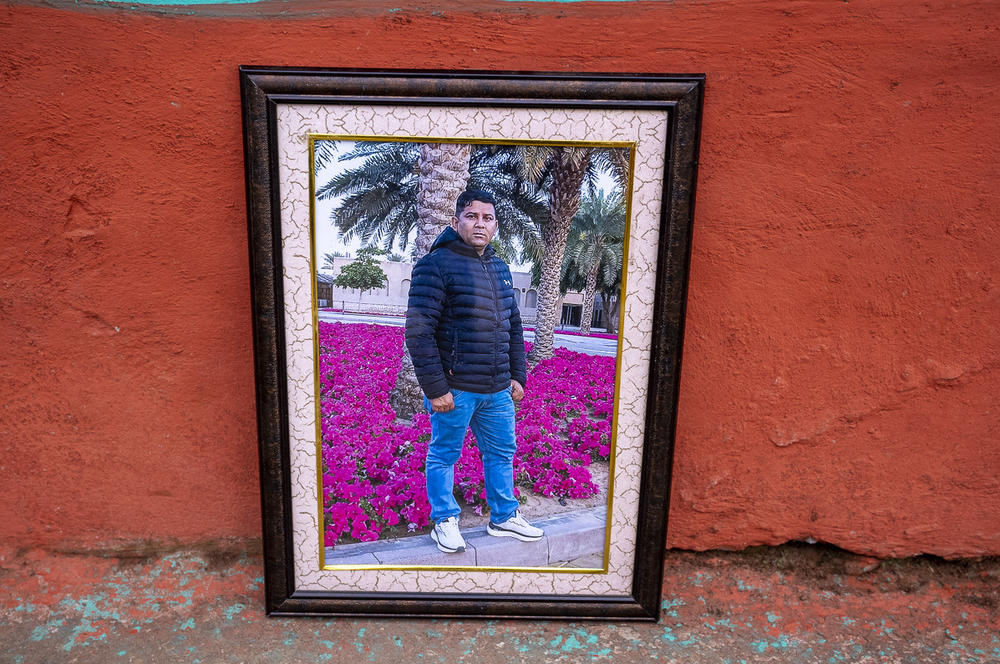 A photograph of Pritam Karki is displayed at his family's home in Nepal.