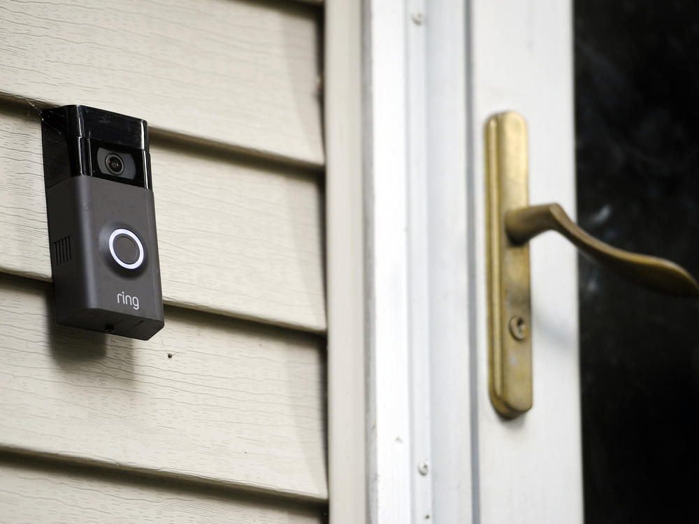 A Ring doorbell camera is seen outside a home in Wolcott, Conn., on July 16, 2019. Amazon-owned Ring said it will stop allowing police departments to request doorbell camera footage from users, marking an end to a feature that has drawn criticism from privacy advocates.